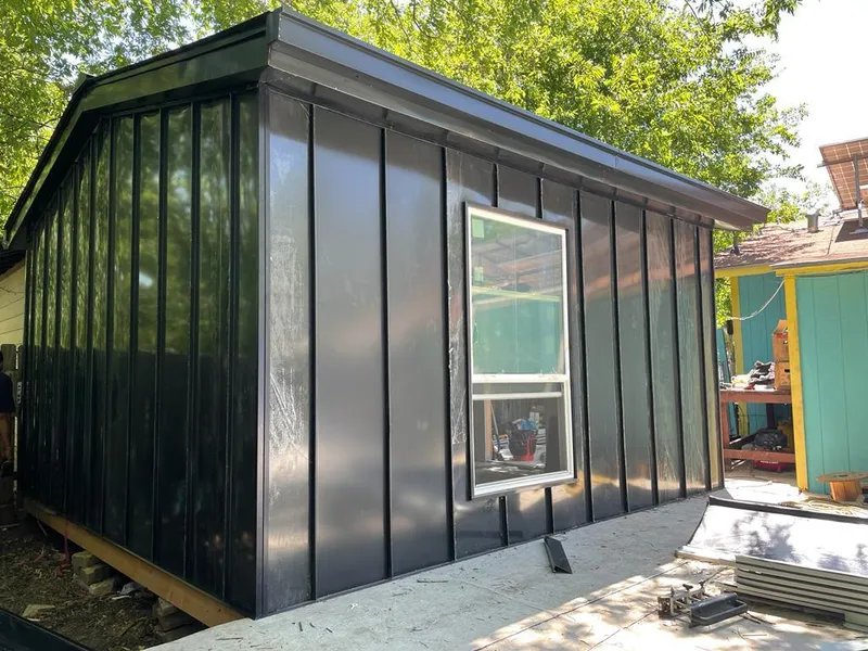 Black standing seam metal wall panels for Roof Inspection in Chesterland